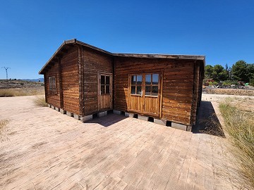 27.000m2 de terreno con cabaña de madera